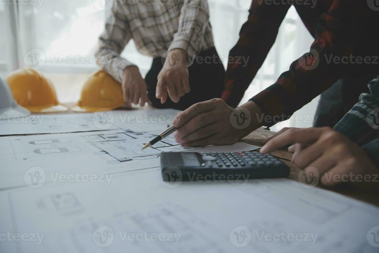 Engineer Teamwork Meeting, Drawing working on blueprint meeting for project working with partner on model building and engineering tools in working site, Construction and structure concept. photo