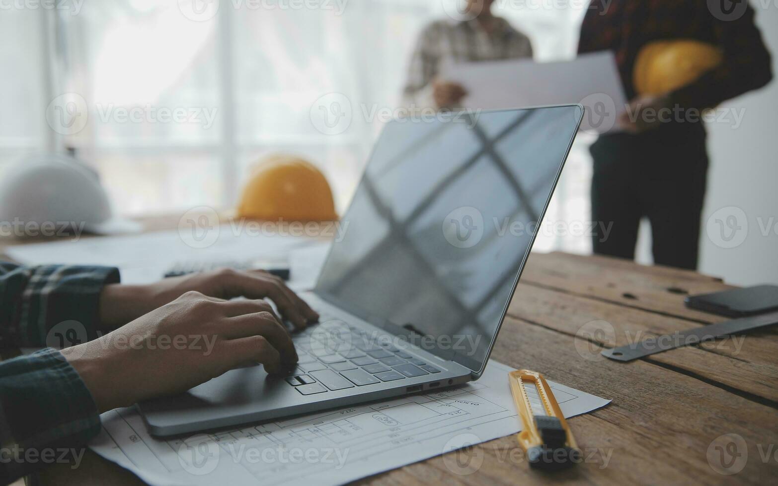 Construction and structure concept of engineer working drawing on blueprint meeting for project working with partner on model building and engineering tools in working site, construction concept. photo