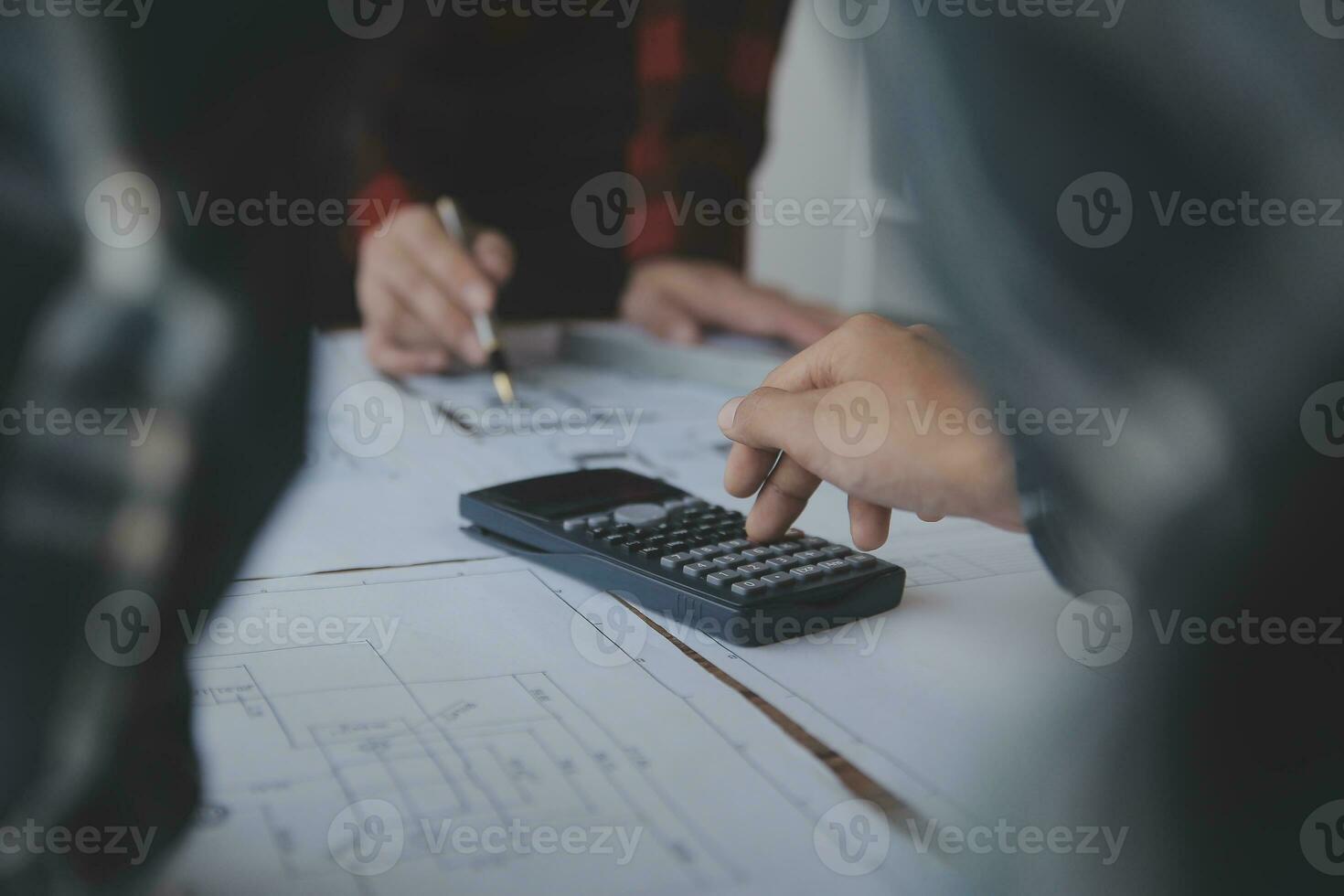 Construction and structure concept of engineer working drawing on blueprint meeting for project working with partner on model building and engineering tools in working site, construction concept. photo