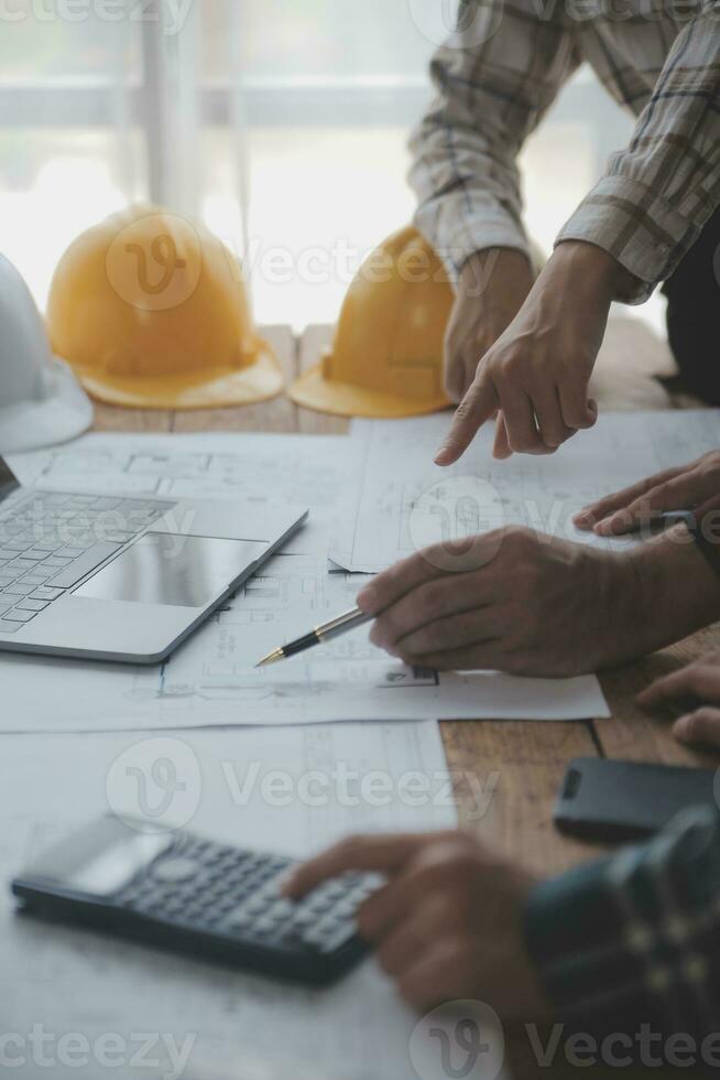 Engineer Teamwork Meeting, Drawing working on blueprint meeting for project working with partner on model building and engineering tools in working site, Construction and structure concept. photo