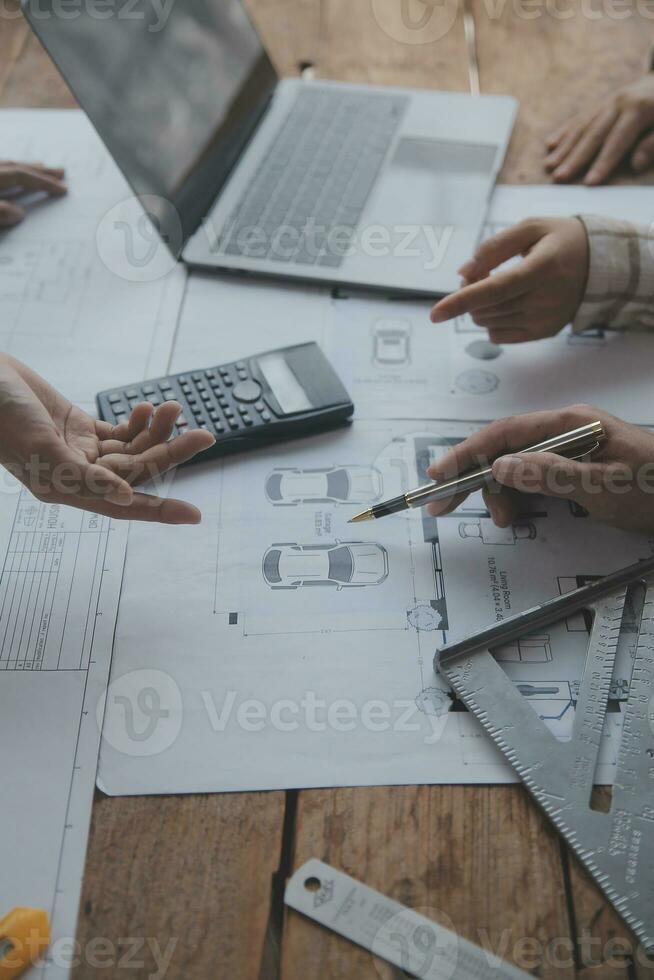 Construction and structure concept of engineer working drawing on blueprint meeting for project working with partner on model building and engineering tools in working site, construction concept. photo