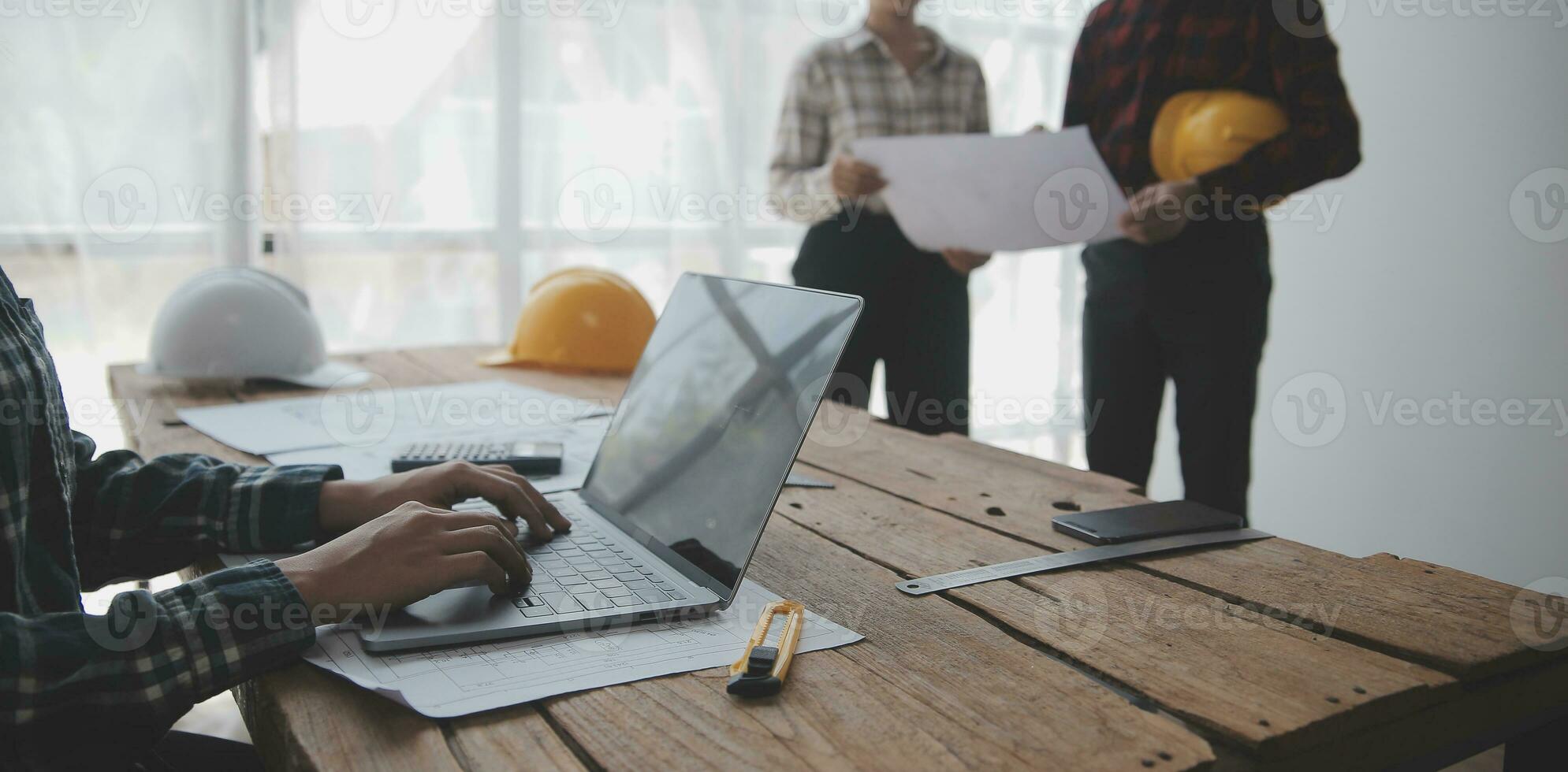 Construction and structure concept of engineer working drawing on blueprint meeting for project working with partner on model building and engineering tools in working site, construction concept. photo