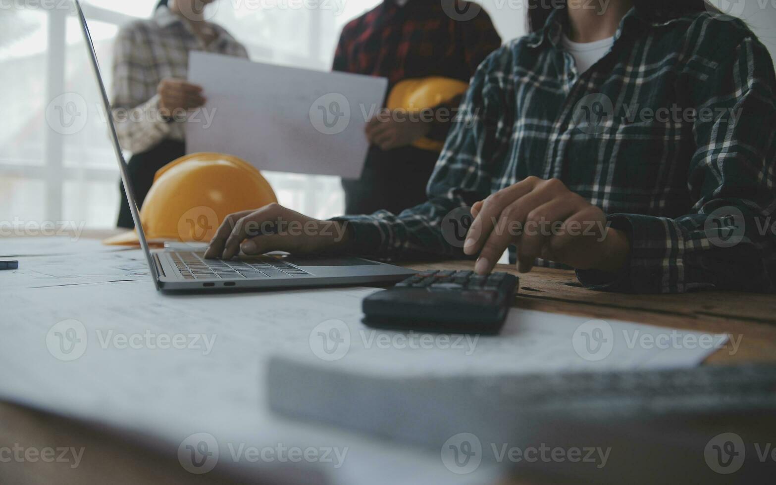 Engineer Teamwork Meeting, Drawing working on blueprint meeting for project working with partner on model building and engineering tools in working site, Construction and structure concept. photo