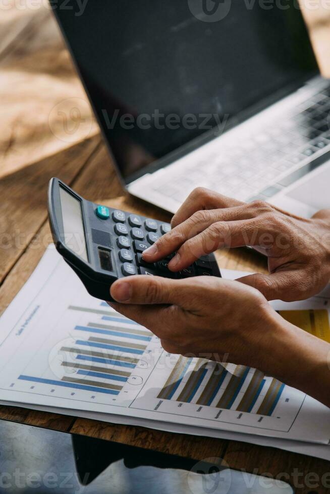 Business Man Financial Inspector and Secretary Making Report, Calculating or Checking Balance. Internal Revenue Service Inspector Checking Document Audit Concept photo