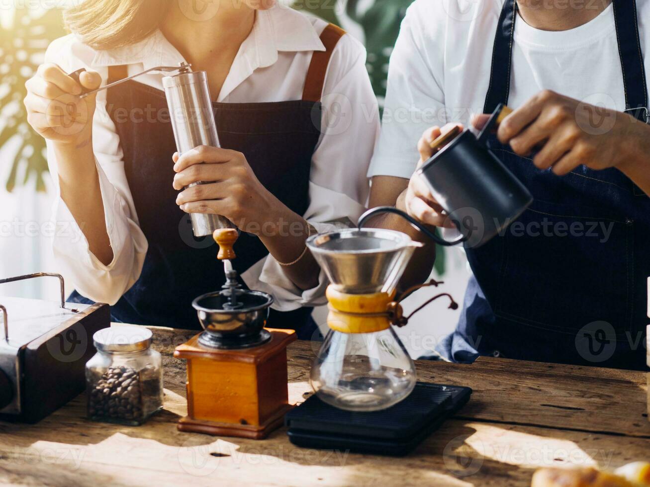 Happy young adult couple making breakfast and drinking coffee together in cozy home kitchen in morning at home. Preparing meal and smiling. Lifestyle, leisure and Love concept. photo