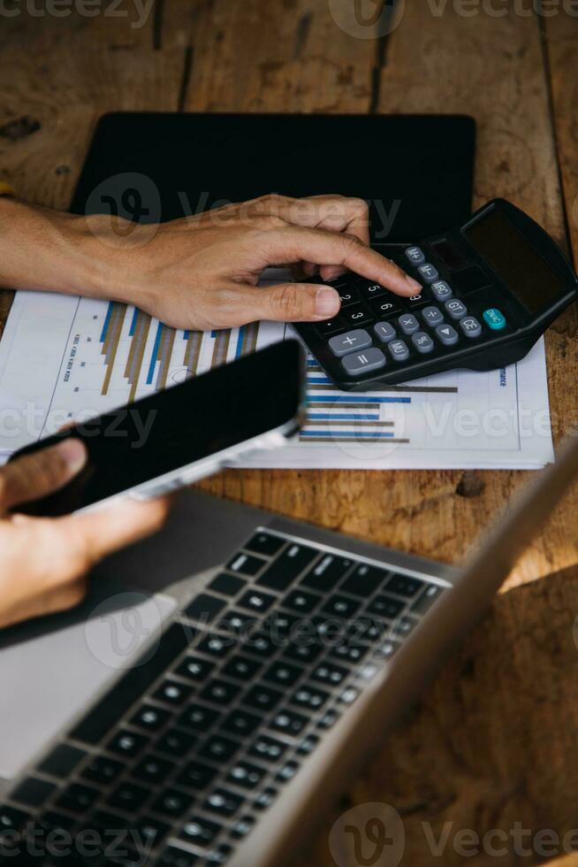 Business Man Financial Inspector and Secretary Making Report, Calculating or Checking Balance. Internal Revenue Service Inspector Checking Document Audit Concept photo
