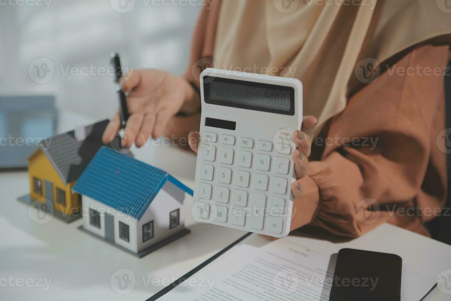 Real estate agent and customer signing contract to buy house, insurance or loan real estate.rent a house,get insurance or loan real estate or property. photo