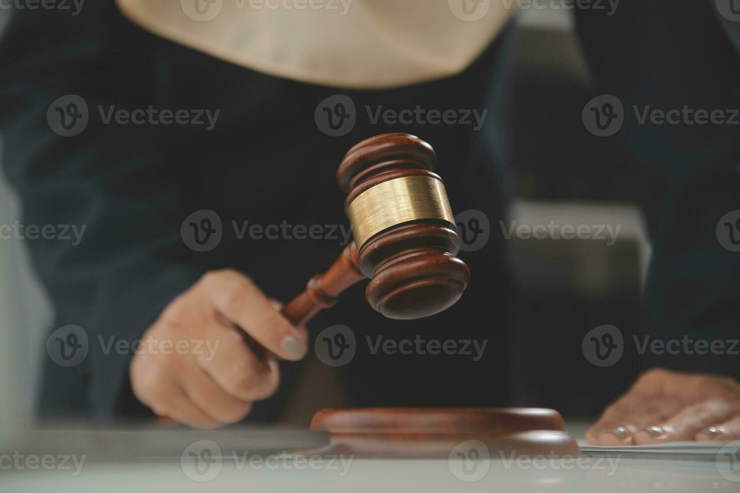 Business and lawyers discussing contract papers with brass scale on desk in office. Law, legal services, advice, justice and law concept picture with film grain effect photo