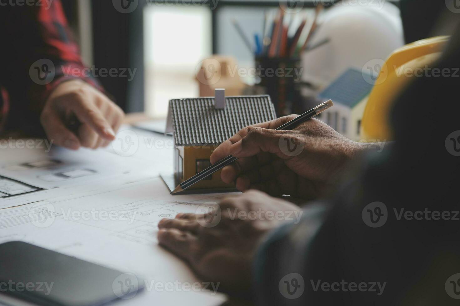 Engineer Teamwork Meeting, Drawing working on blueprint meeting for project working with partner on model building and engineering tools in working site, Construction and structure concept. photo