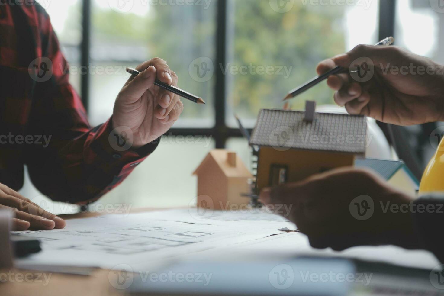 Engineer Teamwork Meeting, Drawing working on blueprint meeting for project working with partner on model building and engineering tools in working site, Construction and structure concept. photo