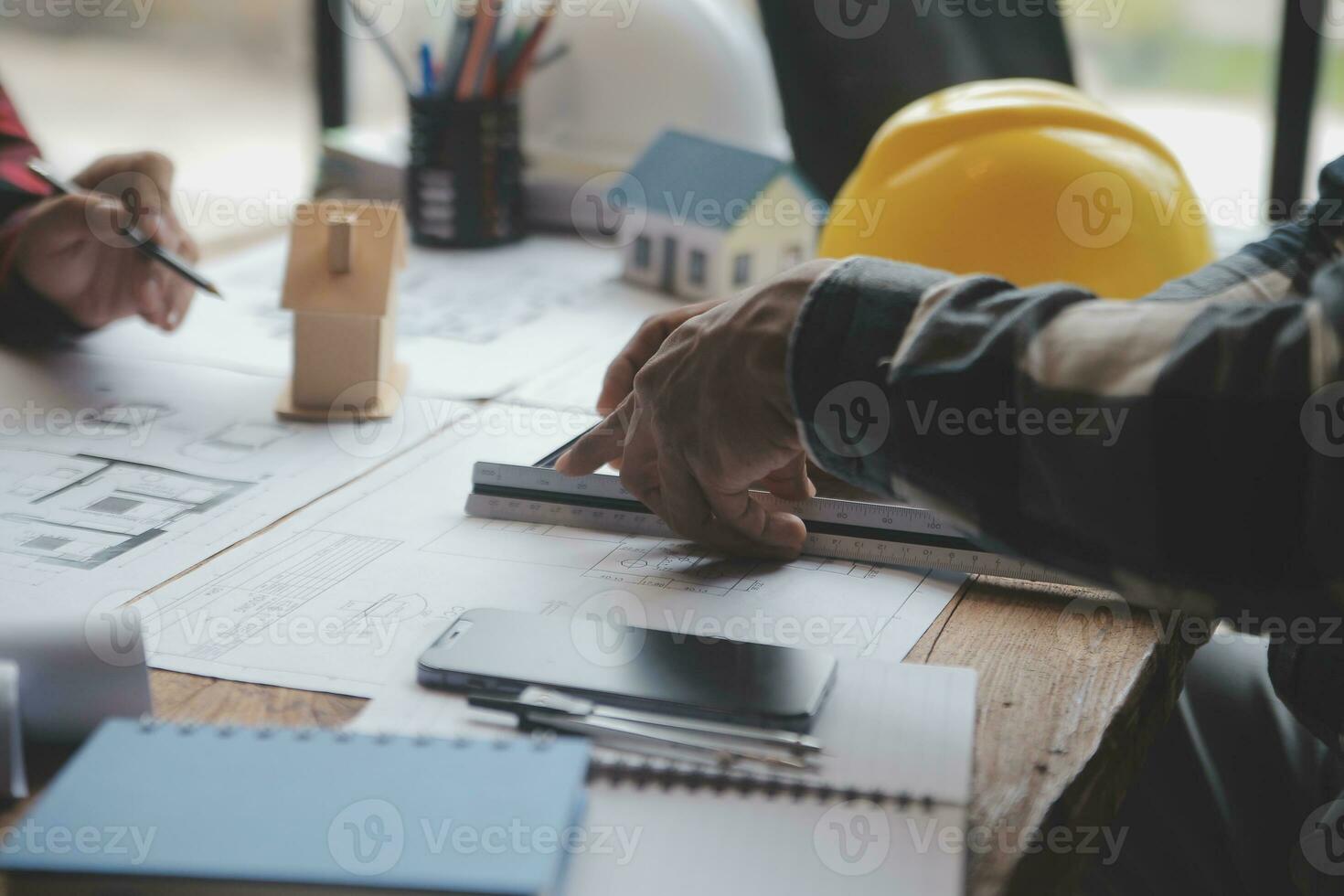Engineer Teamwork Meeting, Drawing working on blueprint meeting for project working with partner on model building and engineering tools in working site, Construction and structure concept. photo