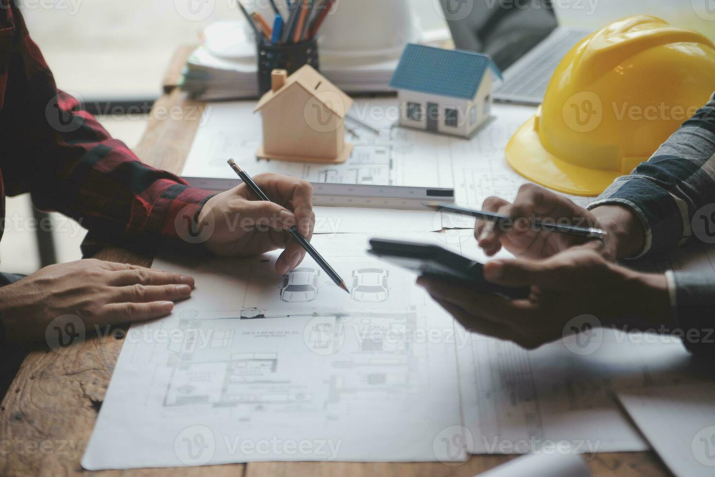 Engineer Teamwork Meeting, Drawing working on blueprint meeting for project working with partner on model building and engineering tools in working site, Construction and structure concept. photo