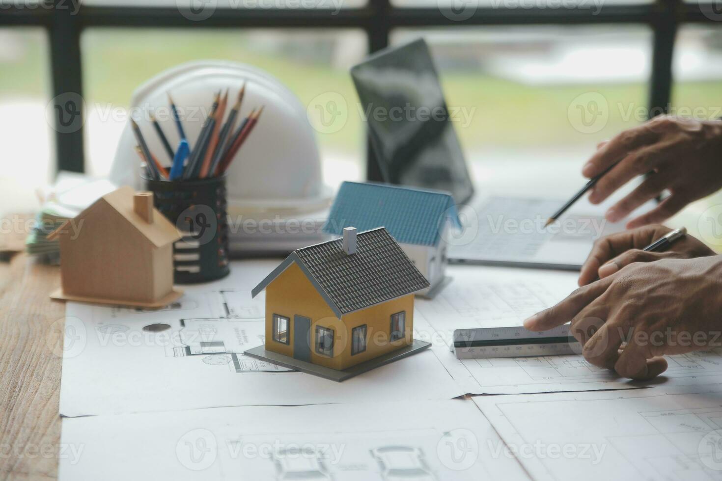 Engineer Teamwork Meeting, Drawing working on blueprint meeting for project working with partner on model building and engineering tools in working site, Construction and structure concept. photo