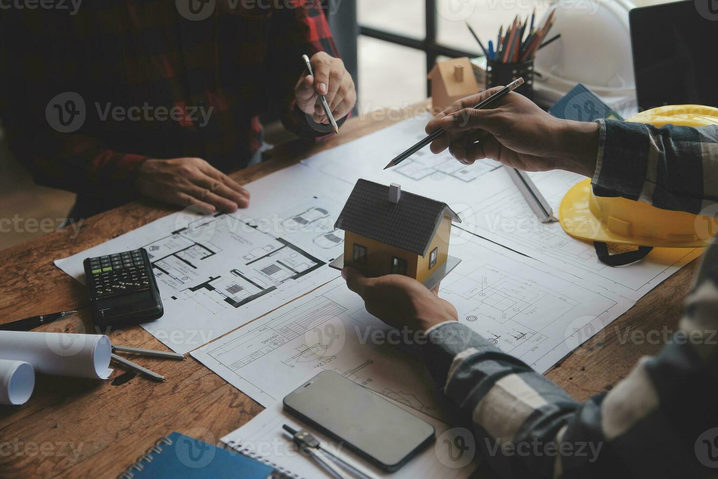 Engineer Teamwork Meeting, Drawing working on blueprint meeting for project working with partner on model building and engineering tools in working site, Construction and structure concept. photo