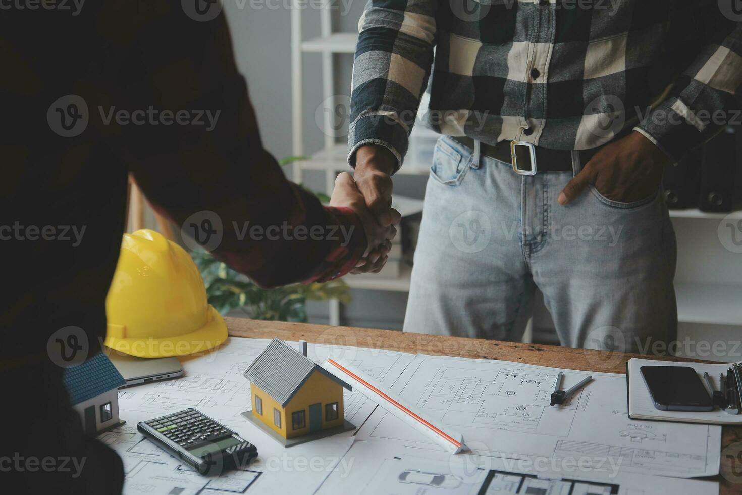 Engineer Teamwork Meeting, Drawing working on blueprint meeting for project working with partner on model building and engineering tools in working site, Construction and structure concept. photo