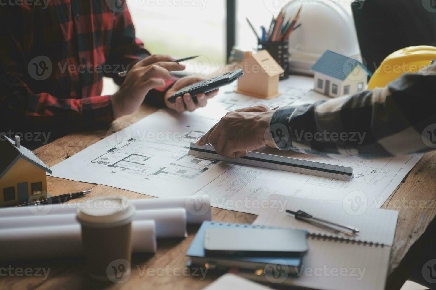 Engineer Teamwork Meeting, Drawing working on blueprint meeting for project working with partner on model building and engineering tools in working site, Construction and structure concept. photo