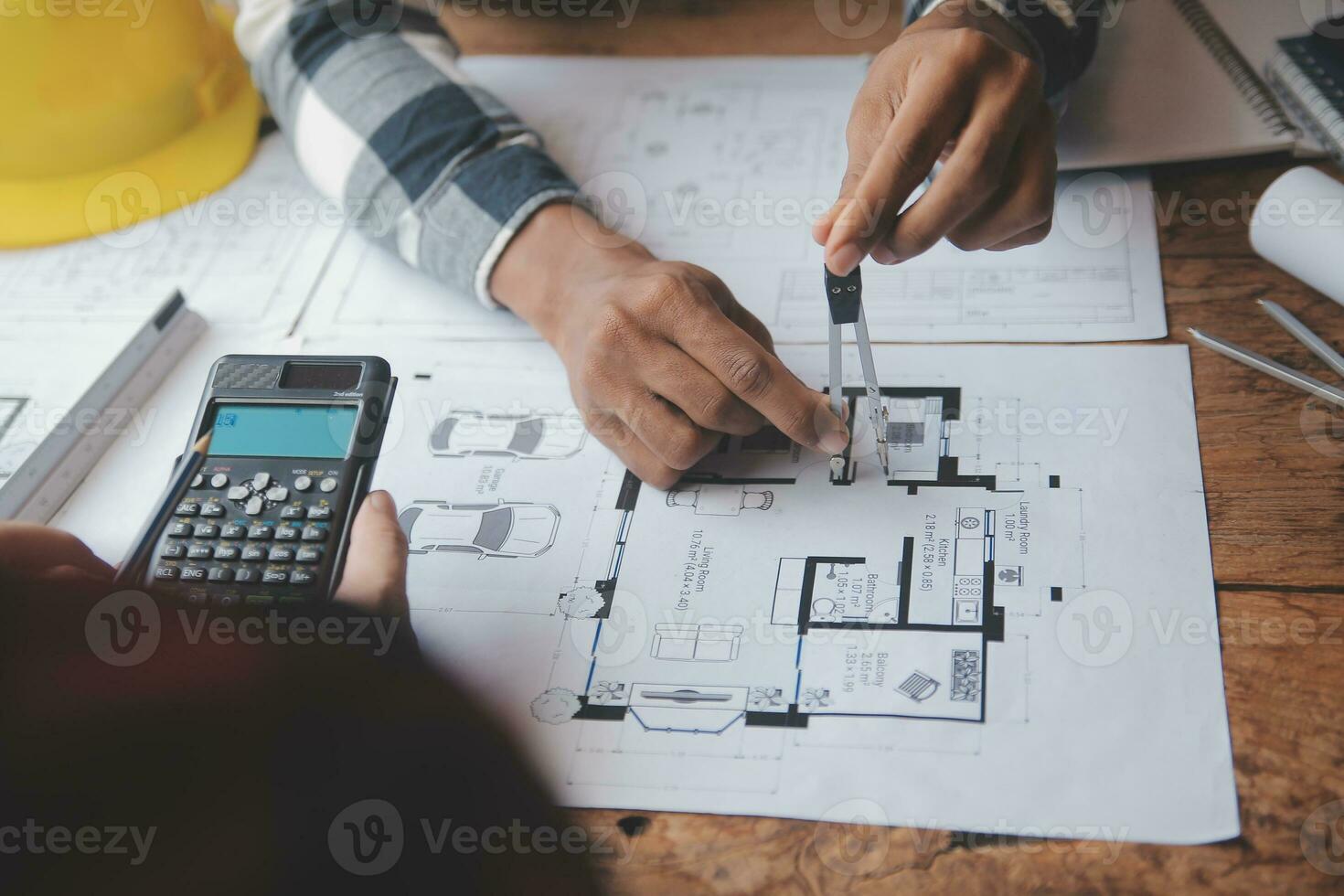 Engineer Teamwork Meeting, Drawing working on blueprint meeting for project working with partner on model building and engineering tools in working site, Construction and structure concept. photo