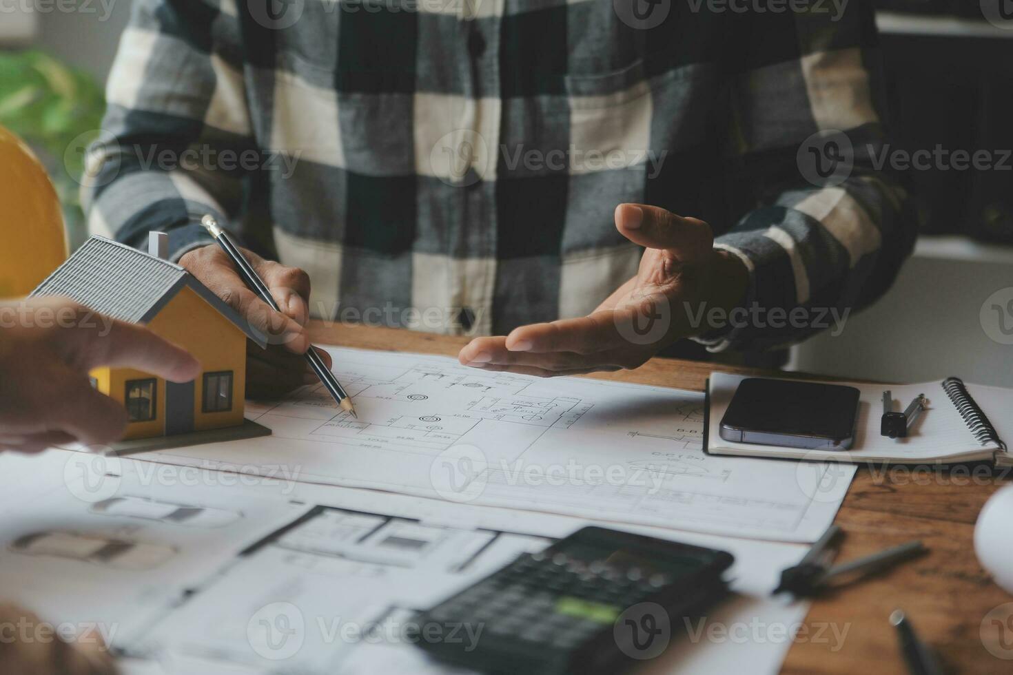 Engineer Teamwork Meeting, Drawing working on blueprint meeting for project working with partner on model building and engineering tools in working site, Construction and structure concept. photo