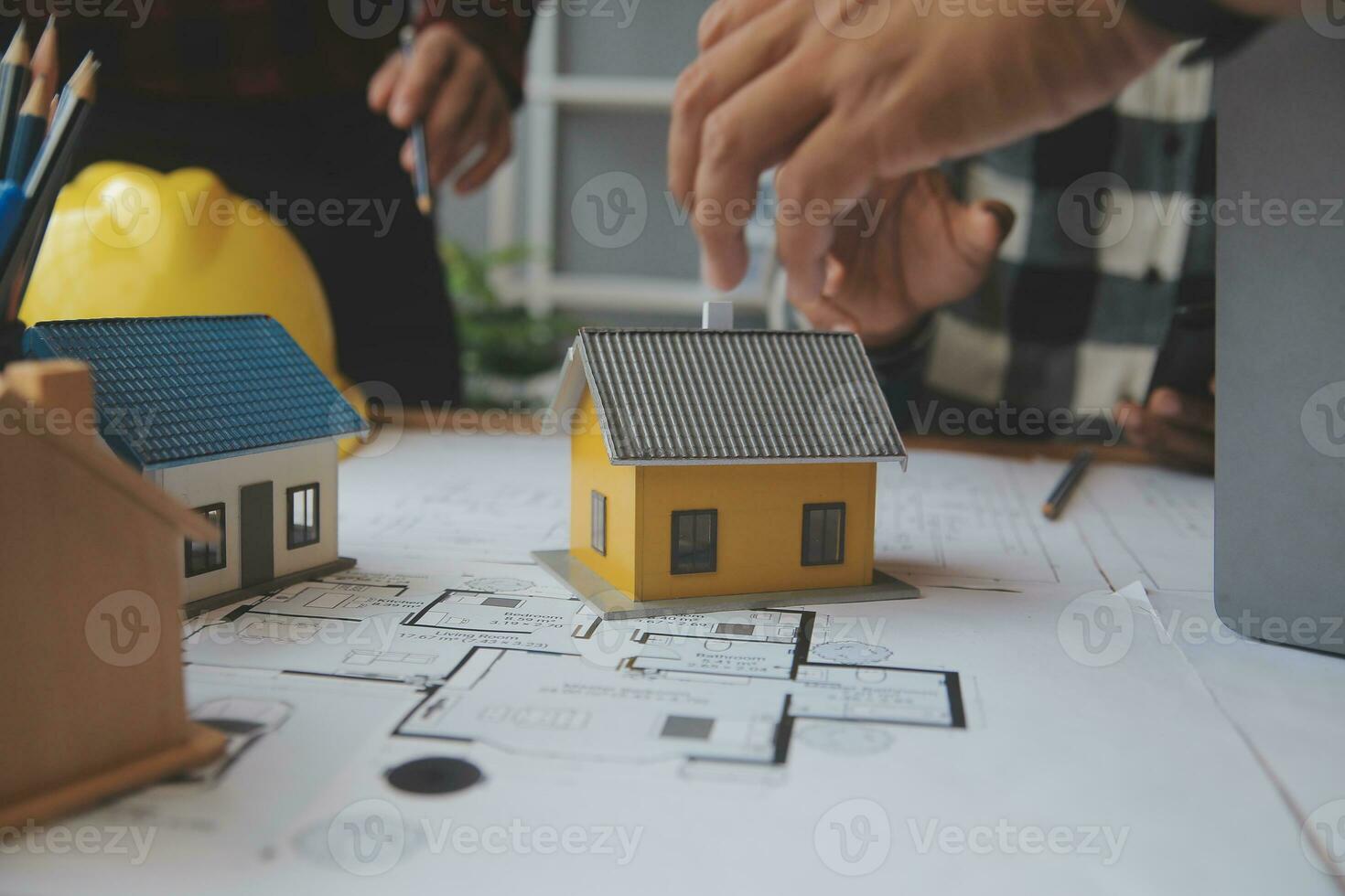 Engineer Teamwork Meeting, Drawing working on blueprint meeting for project working with partner on model building and engineering tools in working site, Construction and structure concept. photo