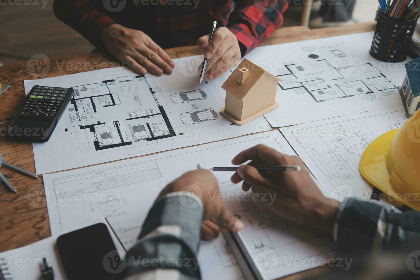 Engineer Teamwork Meeting, Drawing working on blueprint meeting for project working with partner on model building and engineering tools in working site, Construction and structure concept. photo