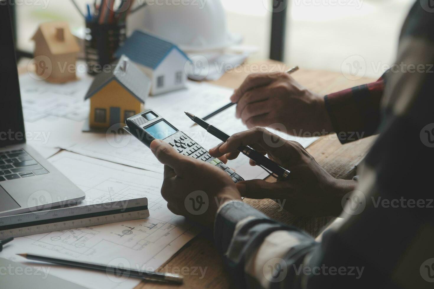Engineer Teamwork Meeting, Drawing working on blueprint meeting for project working with partner on model building and engineering tools in working site, Construction and structure concept. photo