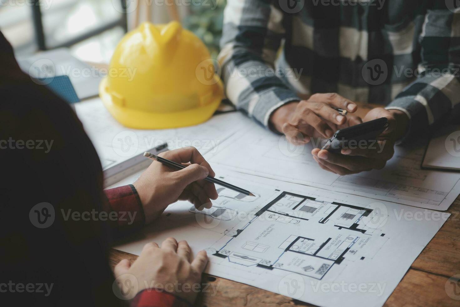 Engineer Teamwork Meeting, Drawing working on blueprint meeting for project working with partner on model building and engineering tools in working site, Construction and structure concept. photo