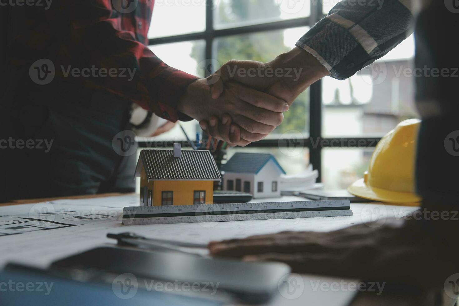 Engineer Teamwork Meeting, Drawing working on blueprint meeting for project working with partner on model building and engineering tools in working site, Construction and structure concept. photo