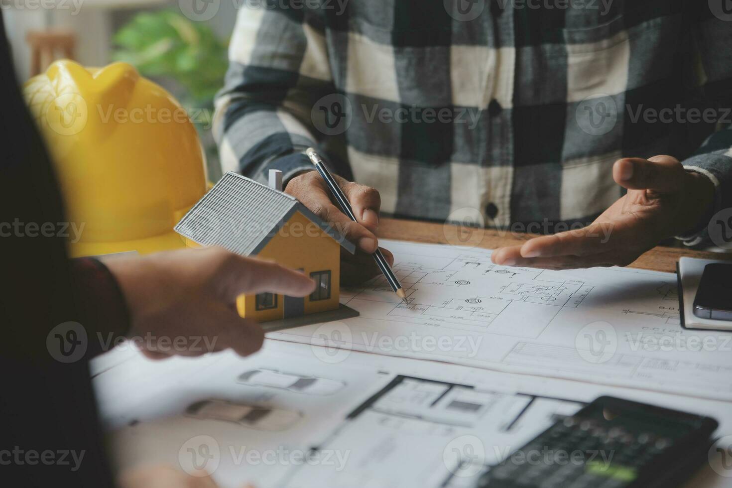 Engineer Teamwork Meeting, Drawing working on blueprint meeting for project working with partner on model building and engineering tools in working site, Construction and structure concept. photo