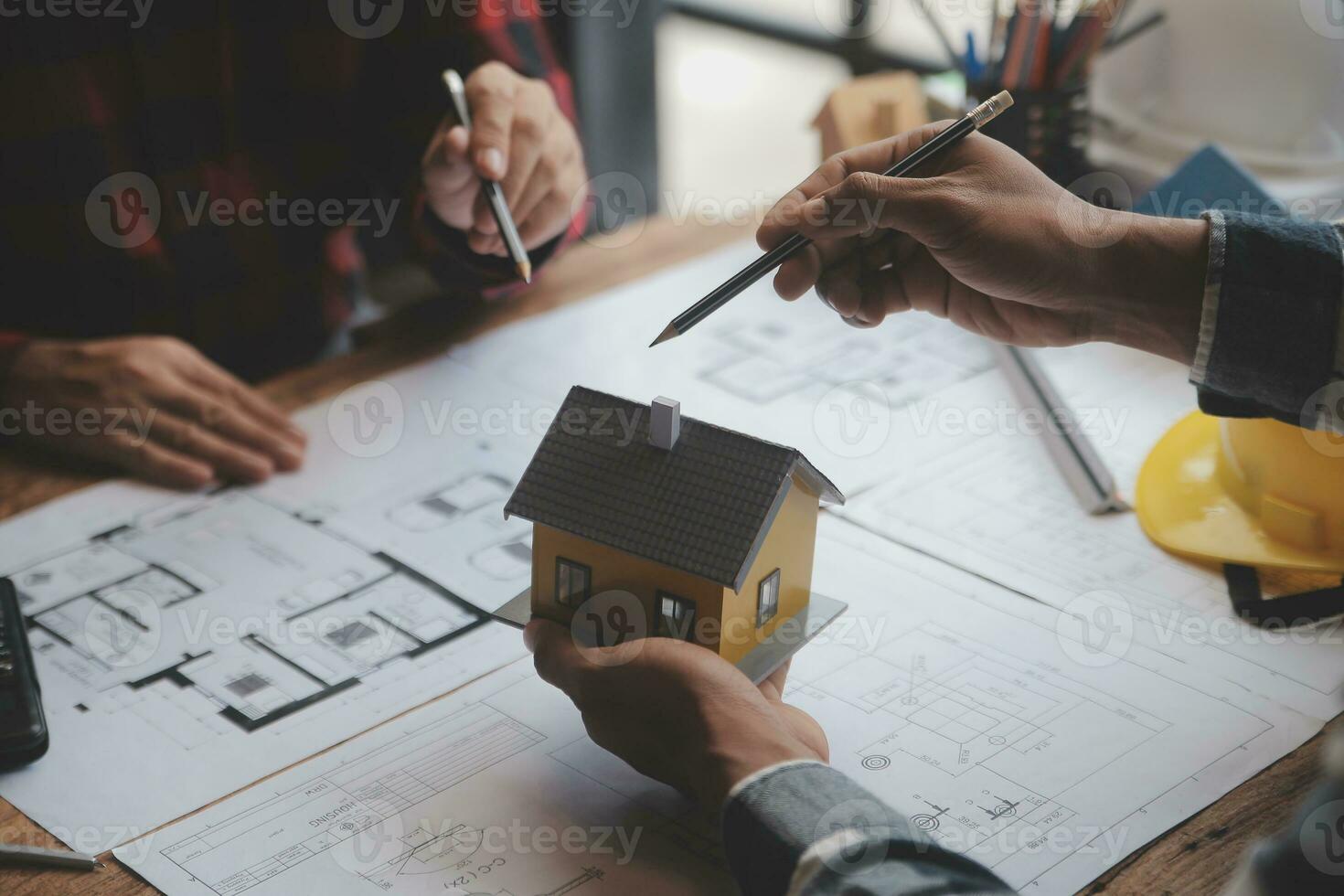 Engineer Teamwork Meeting, Drawing working on blueprint meeting for project working with partner on model building and engineering tools in working site, Construction and structure concept. photo