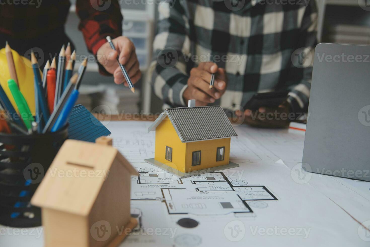 Engineer Teamwork Meeting, Drawing working on blueprint meeting for project working with partner on model building and engineering tools in working site, Construction and structure concept. photo