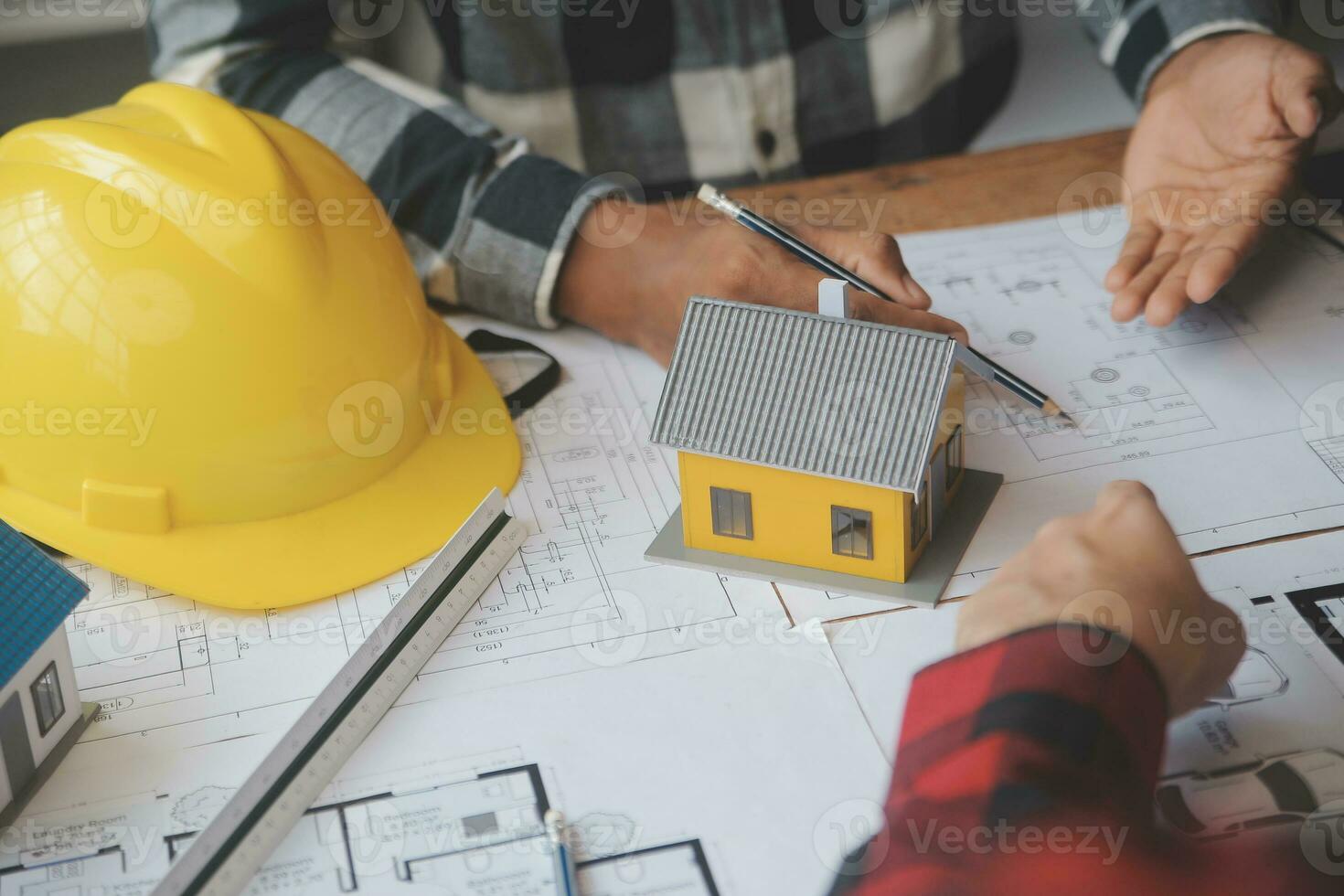 Engineer Teamwork Meeting, Drawing working on blueprint meeting for project working with partner on model building and engineering tools in working site, Construction and structure concept. photo