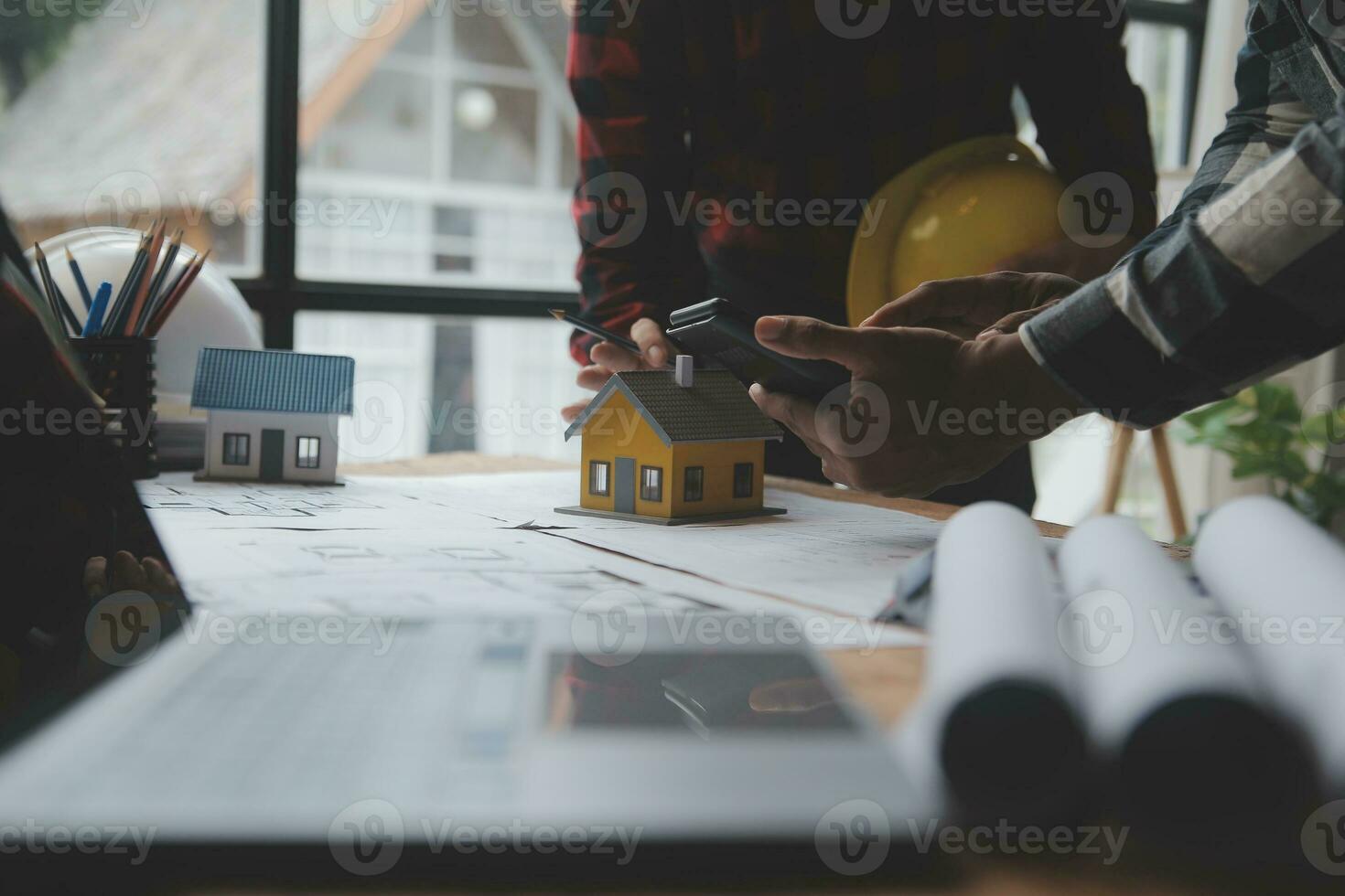Engineer Teamwork Meeting, Drawing working on blueprint meeting for project working with partner on model building and engineering tools in working site, Construction and structure concept. photo