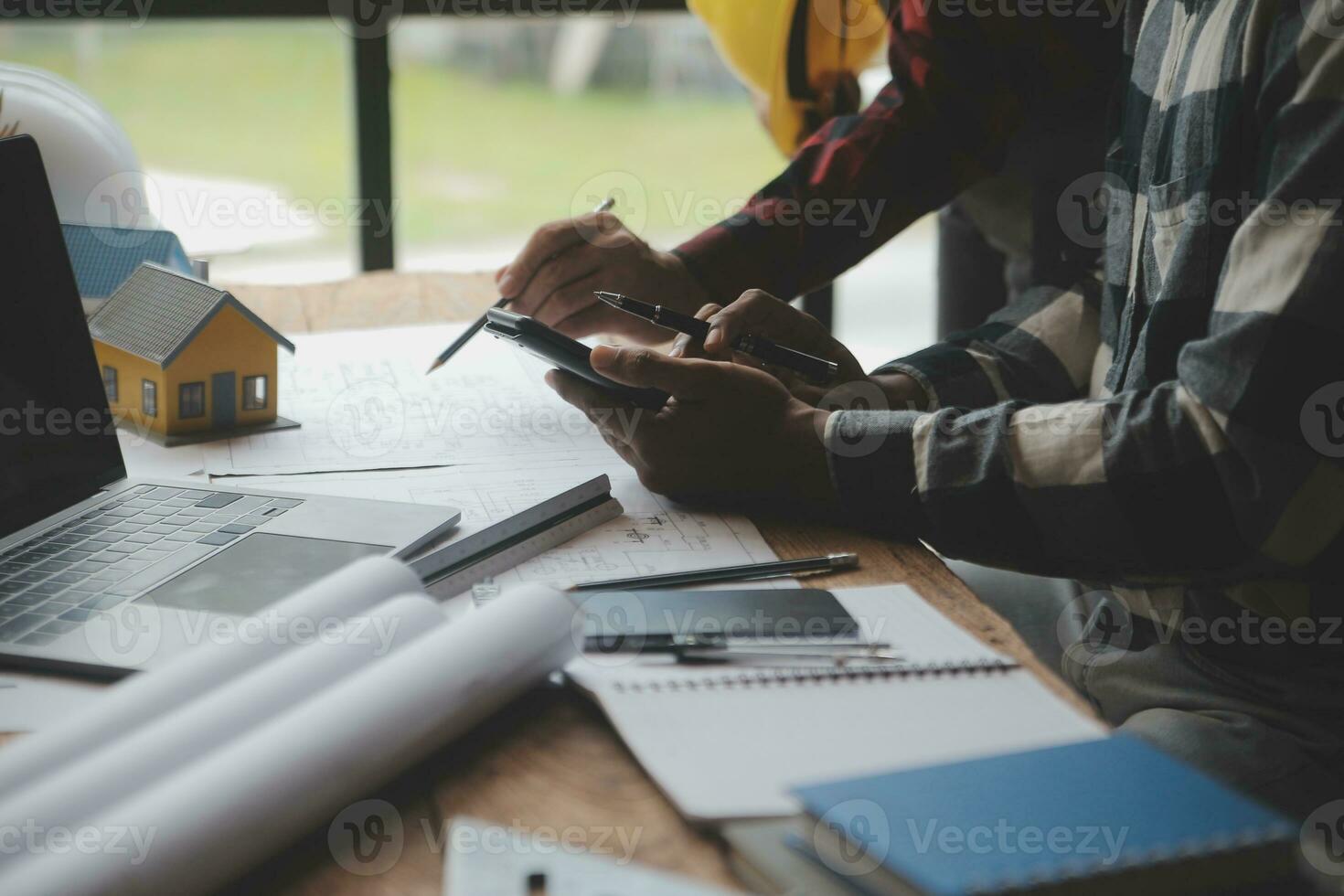 Engineer Teamwork Meeting, Drawing working on blueprint meeting for project working with partner on model building and engineering tools in working site, Construction and structure concept. photo