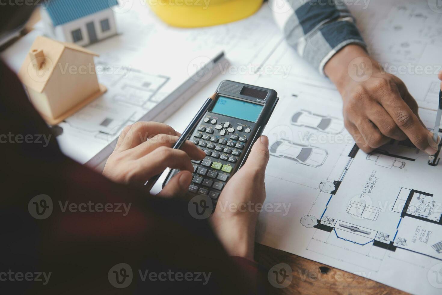 Engineer Teamwork Meeting, Drawing working on blueprint meeting for project working with partner on model building and engineering tools in working site, Construction and structure concept. photo