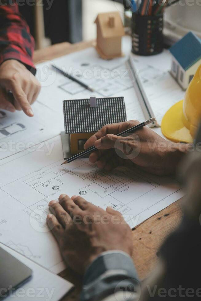 Engineer Teamwork Meeting, Drawing working on blueprint meeting for project working with partner on model building and engineering tools in working site, Construction and structure concept. photo