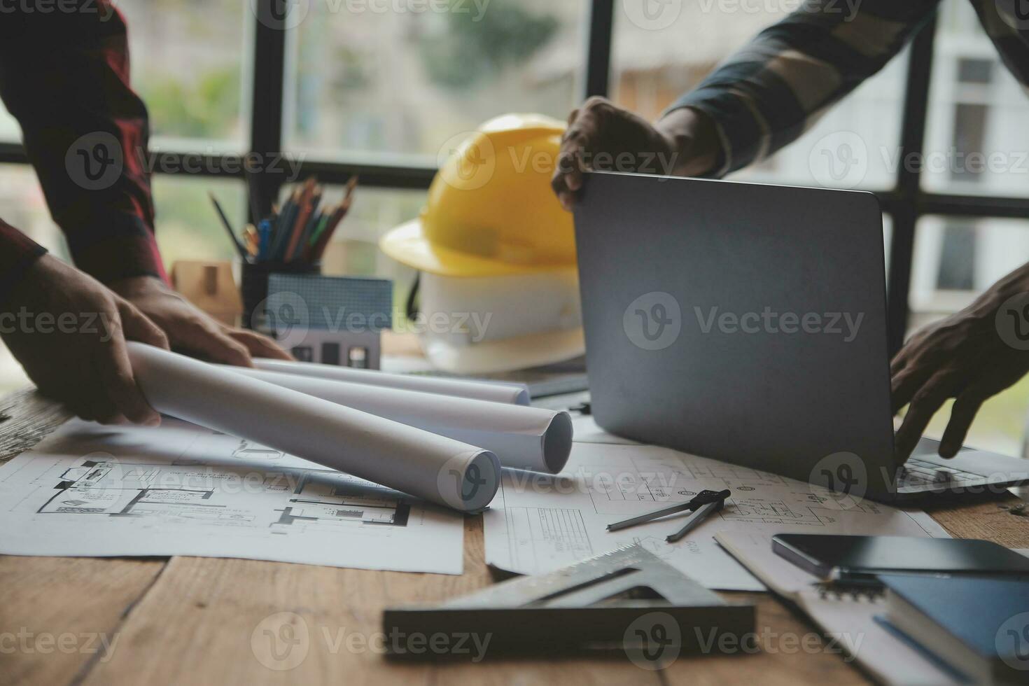 Engineer Teamwork Meeting, Drawing working on blueprint meeting for project working with partner on model building and engineering tools in working site, Construction and structure concept. photo