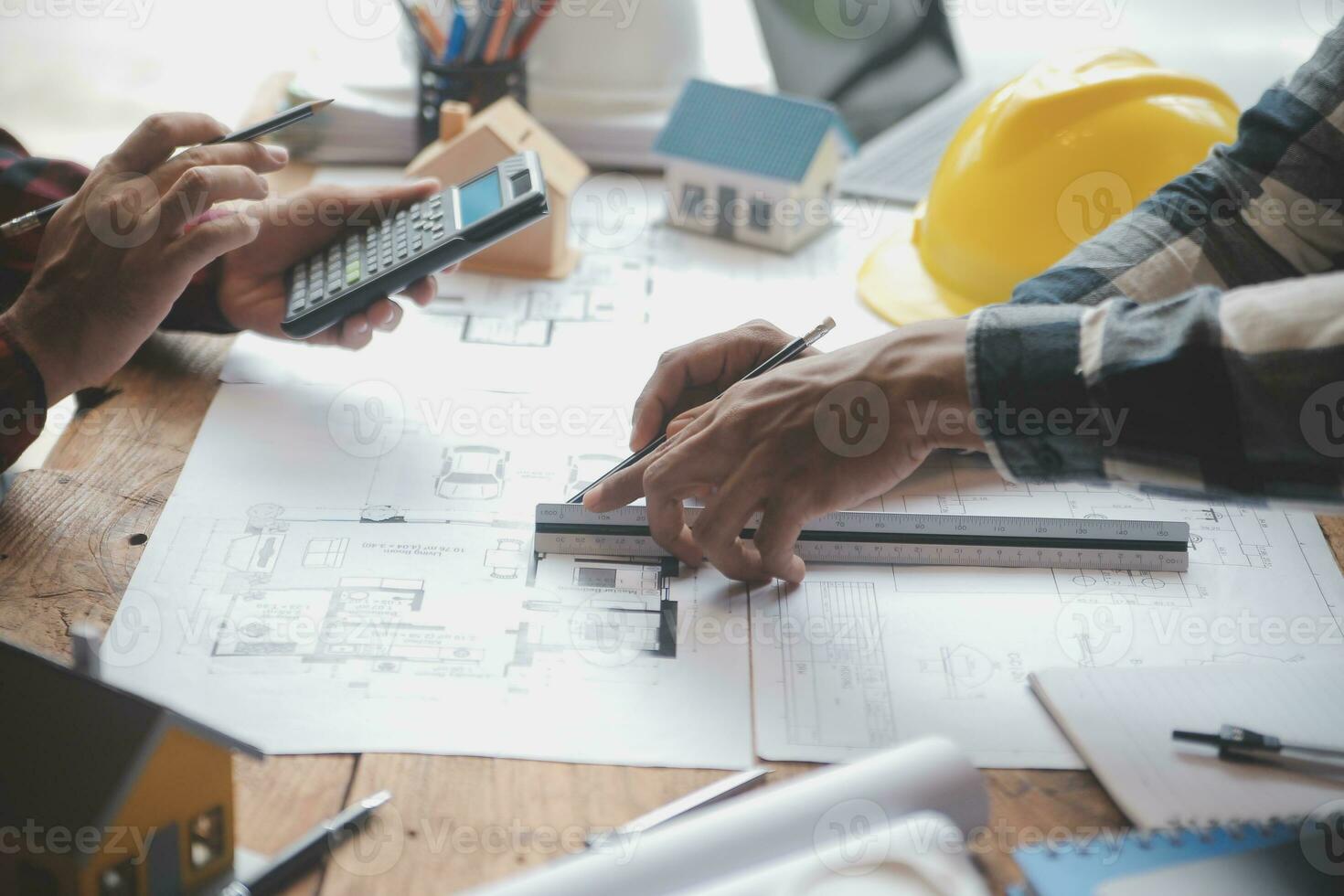 Engineer Teamwork Meeting, Drawing working on blueprint meeting for project working with partner on model building and engineering tools in working site, Construction and structure concept. photo