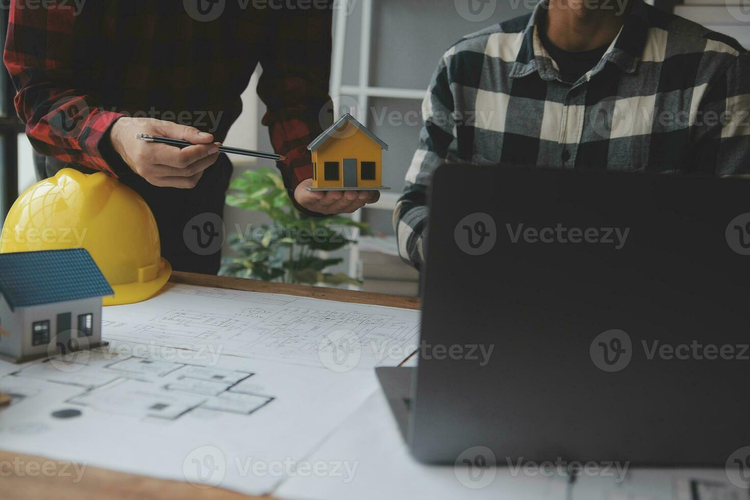 Engineer Teamwork Meeting, Drawing working on blueprint meeting for project working with partner on model building and engineering tools in working site, Construction and structure concept. photo