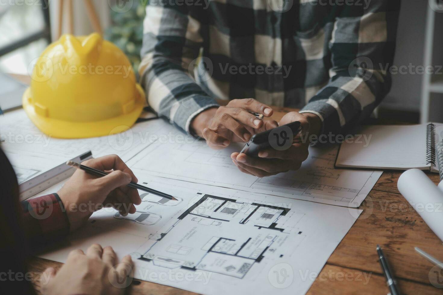 Engineer Teamwork Meeting, Drawing working on blueprint meeting for project working with partner on model building and engineering tools in working site, Construction and structure concept. photo