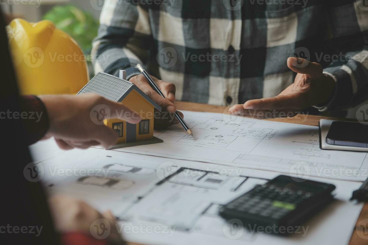 Engineer Teamwork Meeting, Drawing working on blueprint meeting for project working with partner on model building and engineering tools in working site, Construction and structure concept. photo