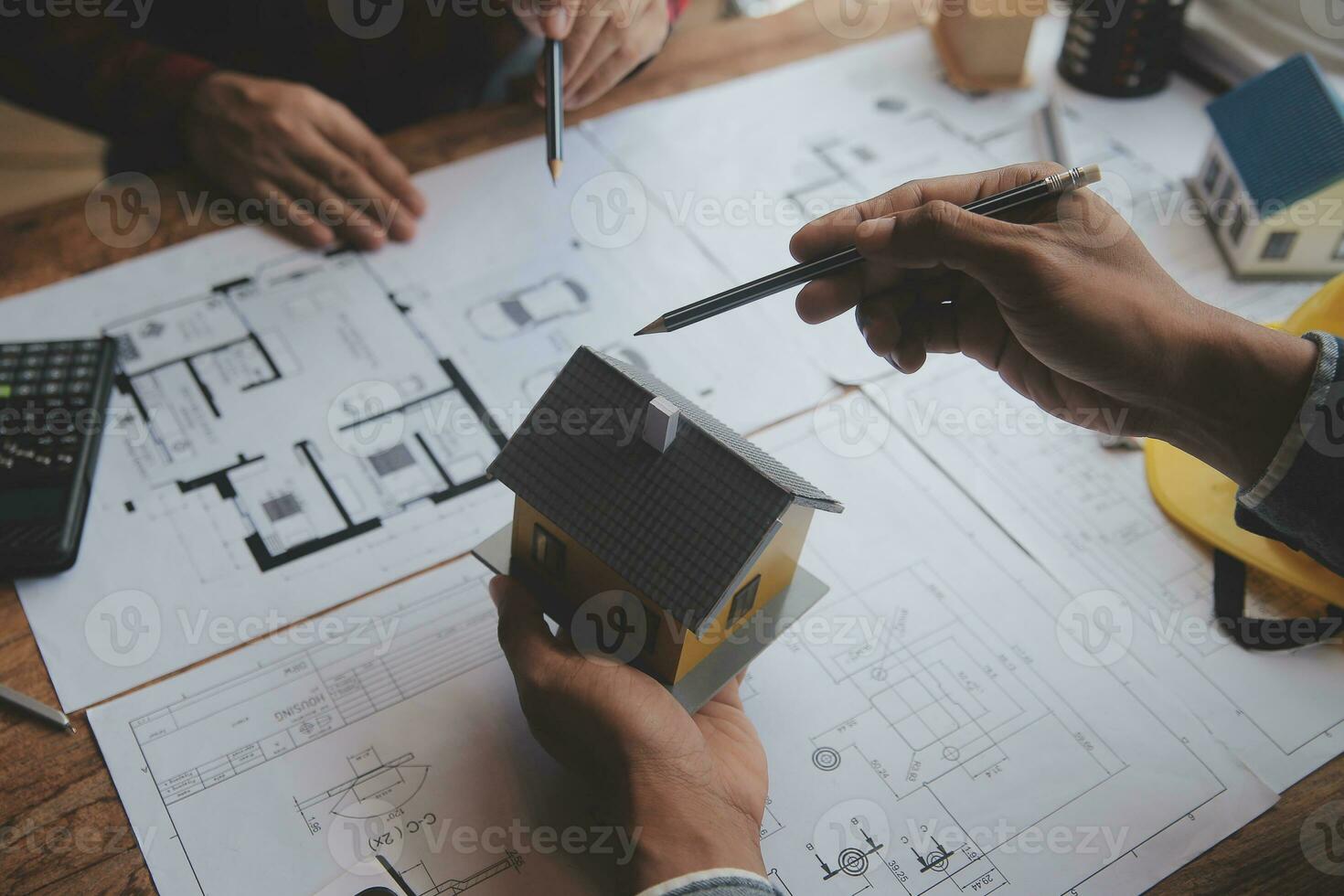 Engineer Teamwork Meeting, Drawing working on blueprint meeting for project working with partner on model building and engineering tools in working site, Construction and structure concept. photo