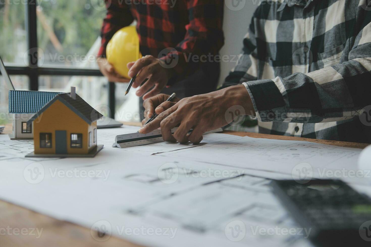 Engineer Teamwork Meeting, Drawing working on blueprint meeting for project working with partner on model building and engineering tools in working site, Construction and structure concept. photo