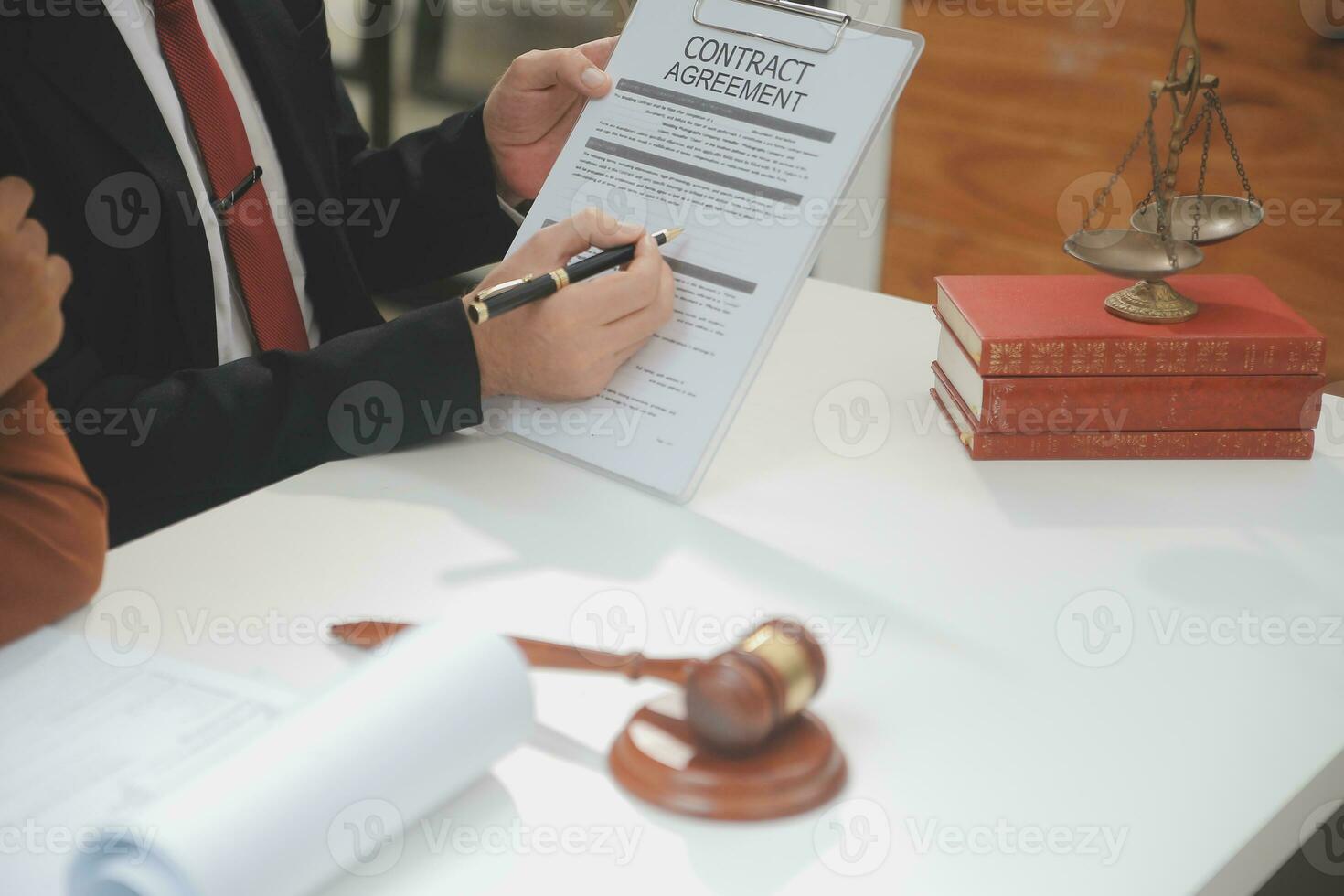 Business and lawyers discussing contract papers with brass scale on desk in office. Law, legal services, advice, justice and law concept picture with film grain effect photo