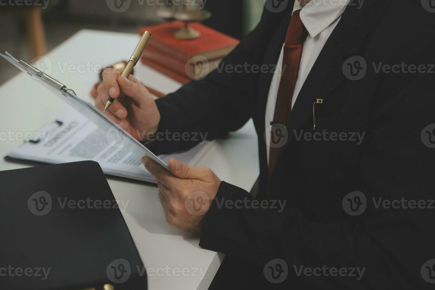 Business and lawyers discussing contract papers with brass scale on desk in office. Law, legal services, advice, justice and law concept picture with film grain effect photo