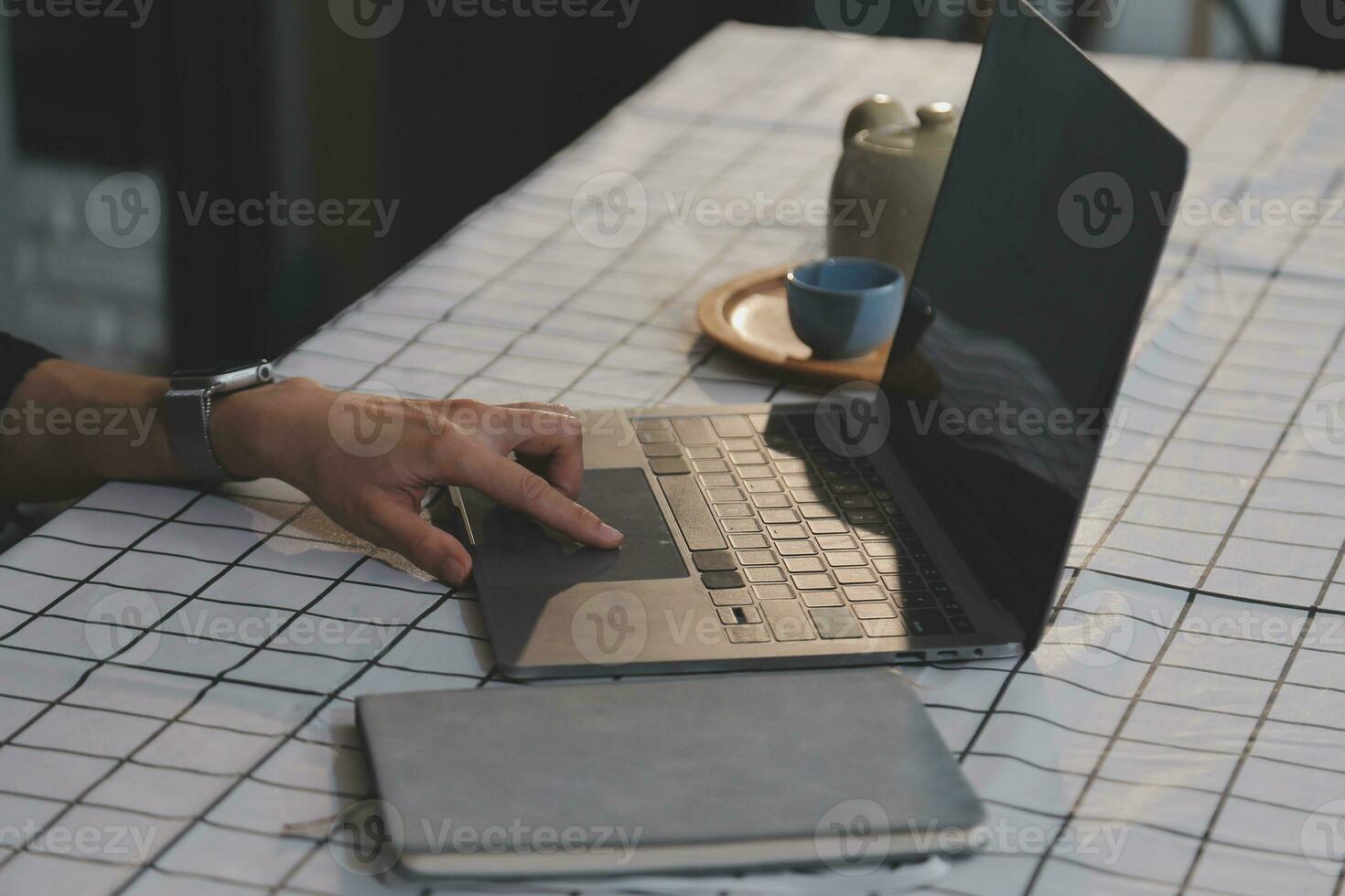 Cropped photo of Freelancer business Asian woman holding coffee cup and at doing planning analyzing the financial report, business plan investment, finance analysis the workplace.