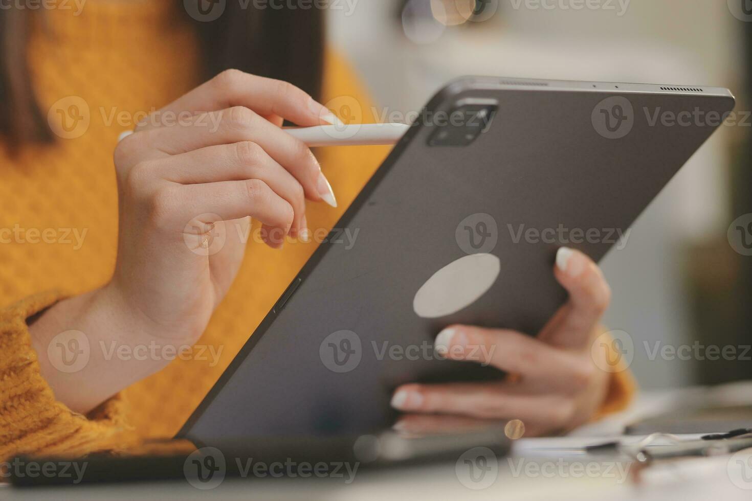 Cropped photo of Freelancer business Asian woman holding coffee cup and at doing planning analyzing the financial report, business plan investment, finance analysis the workplace.