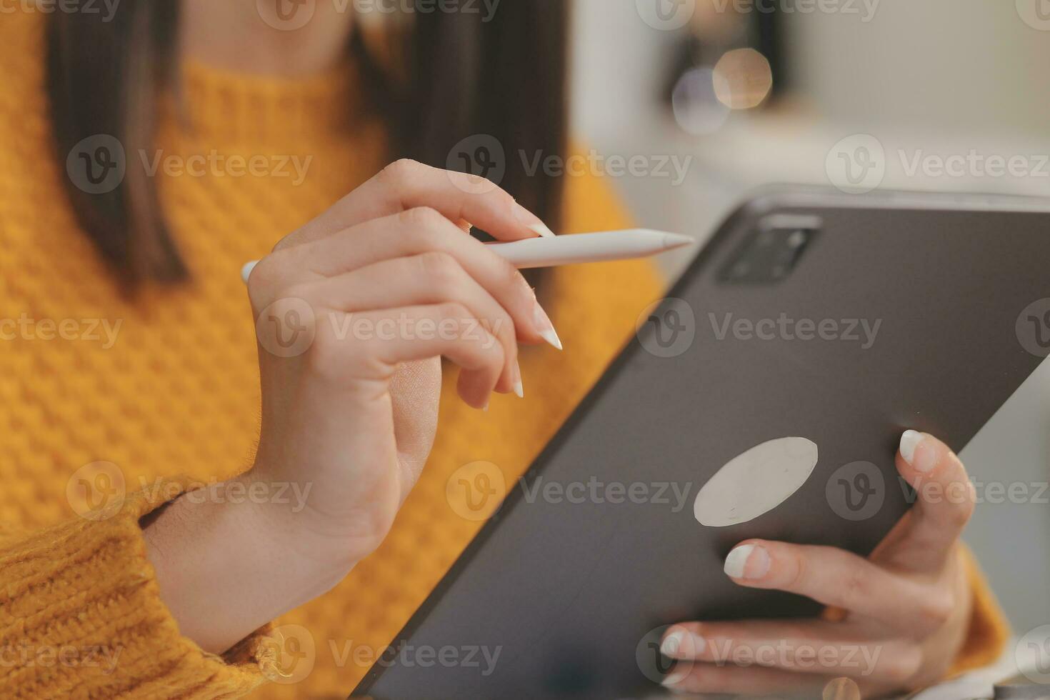 Cropped photo of Freelancer business Asian woman holding coffee cup and at doing planning analyzing the financial report, business plan investment, finance analysis the workplace.
