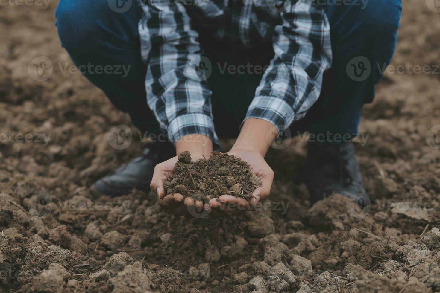 Symbol heart earth day. Handful of dirt hands heart shape. Farm organic earth. Farmer hands soil ground earth dirt garden soil farm ground. Male hands full of fertile land field agriculture concept photo