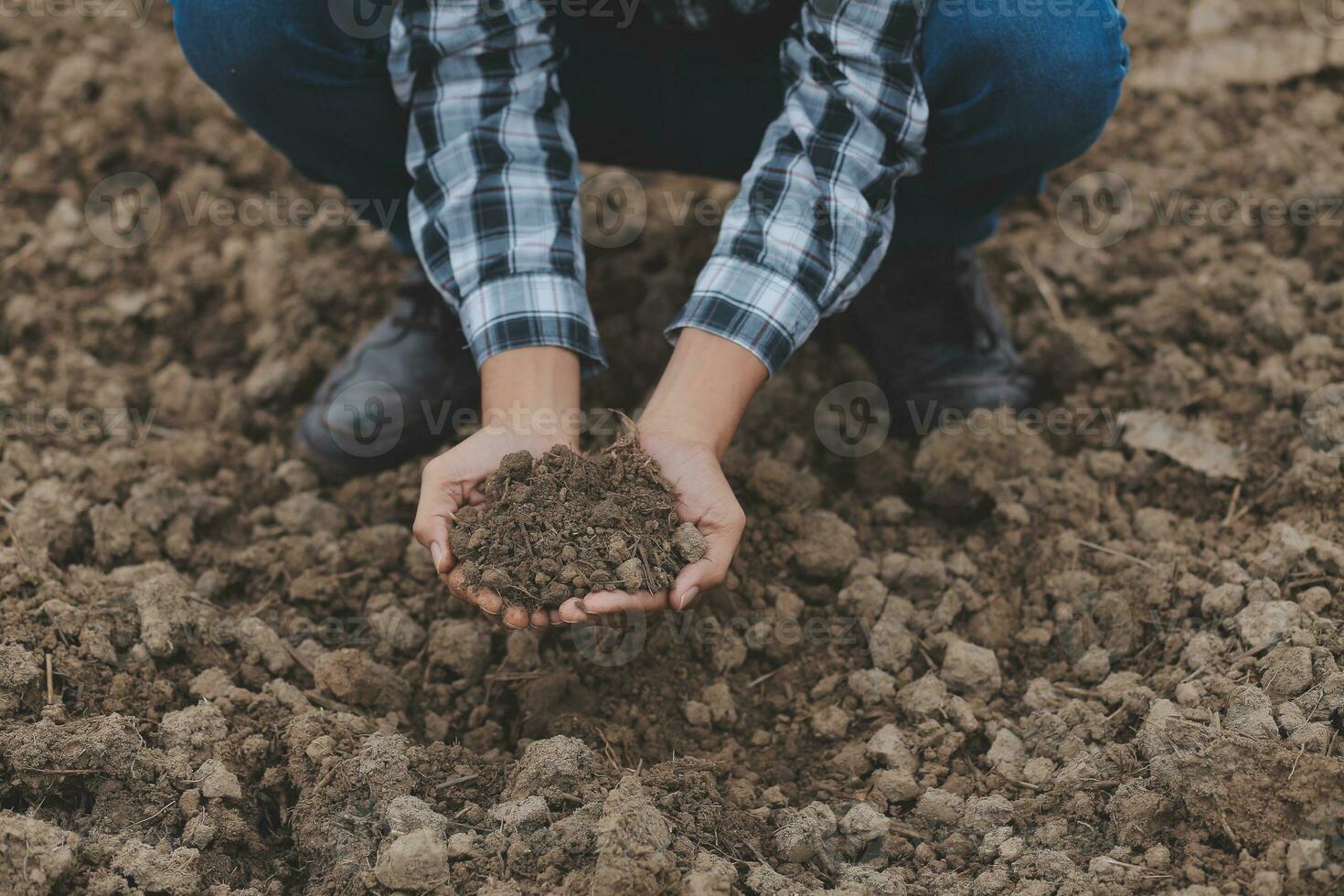 Symbol heart earth day. Handful of dirt hands heart shape. Farm organic earth. Farmer hands soil ground earth dirt garden soil farm ground. Male hands full of fertile land field agriculture concept photo