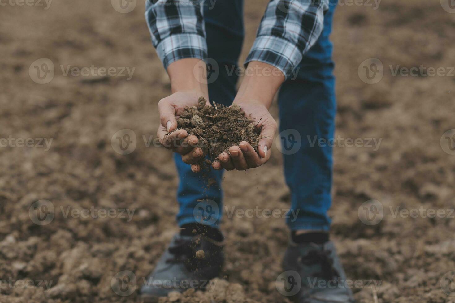 Symbol heart earth day. Handful of dirt hands heart shape. Farm organic earth. Farmer hands soil ground earth dirt garden soil farm ground. Male hands full of fertile land field agriculture concept photo